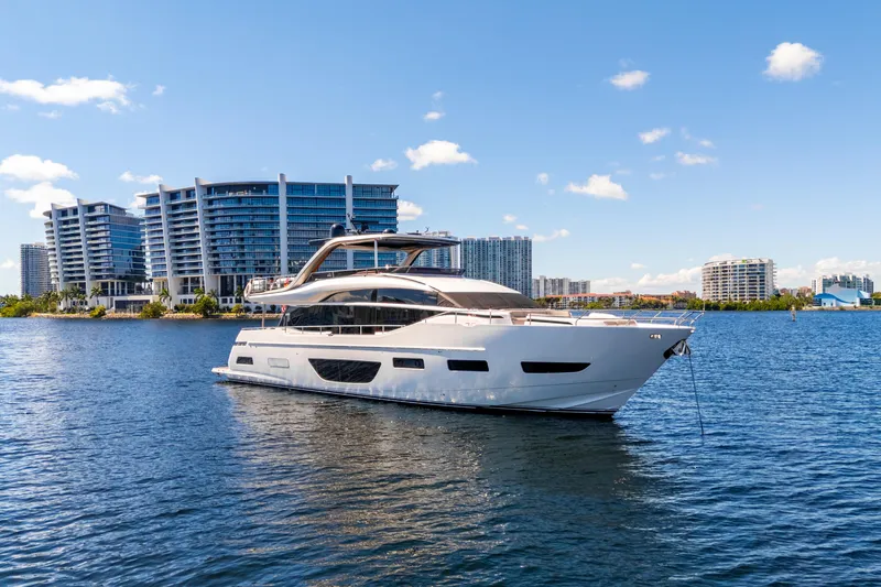  Yacht Photos Pics Luxurious 2022 Princess Y85 yacht on water with modern cityscape background.