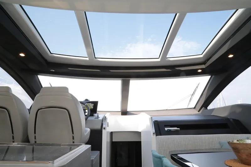 No Time To Die Yacht Photos Pics Interior view of 2023 Azimut S8 yacht with panoramic windows and modern design.