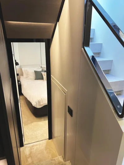 No Time To Die Yacht Photos Pics 2023 Azimut S8 yacht interior with modern staircase and cozy bedroom.