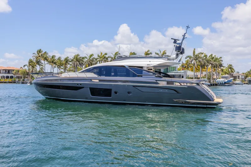 No Time To Die Yacht Photos Pics 2023 Azimut S8 yacht cruising on a sunny day with palm trees in the background.