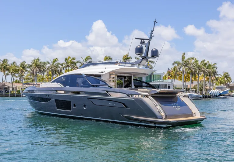 No Time To Die Yacht Photos Pics Luxury 2023 Azimut S8 yacht cruising on a sunny day with palm trees in the background.
