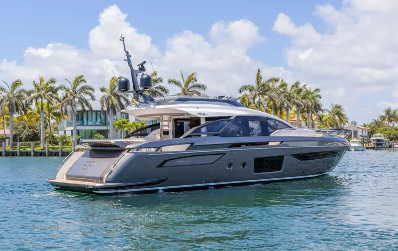 No Time To Die Yacht Photos Pics 2023 Azimut S8 yacht cruising on a sunny day with palm trees in the background.