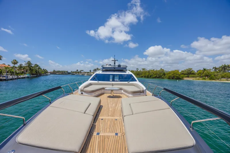 No Time To Die Yacht Photos Pics 2023 Azimut S8 yacht cruising on a sunny day with luxurious deck seating.