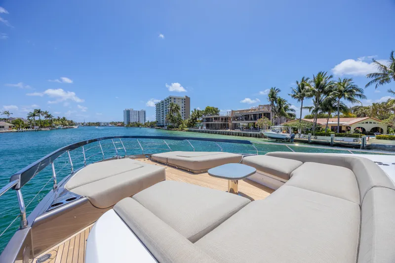 No Time To Die Yacht Photos Pics 2023 Azimut S8 yacht with luxurious deck seating, overlooking a scenic waterfront view.