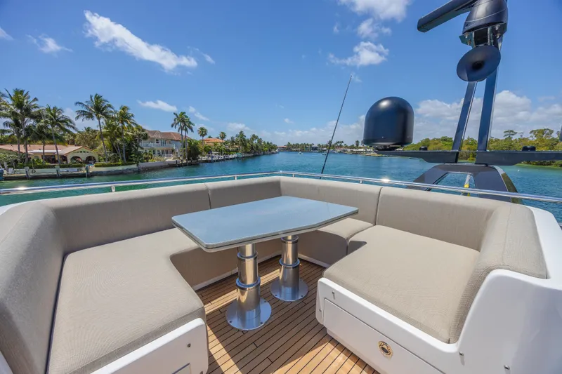 No Time To Die Yacht Photos Pics Luxurious seating area on 2023 Azimut S8 yacht with scenic waterfront view.