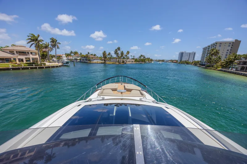 No Time To Die Yacht Photos Pics 2023 Azimut S8 yacht cruising through a scenic, tropical waterway.