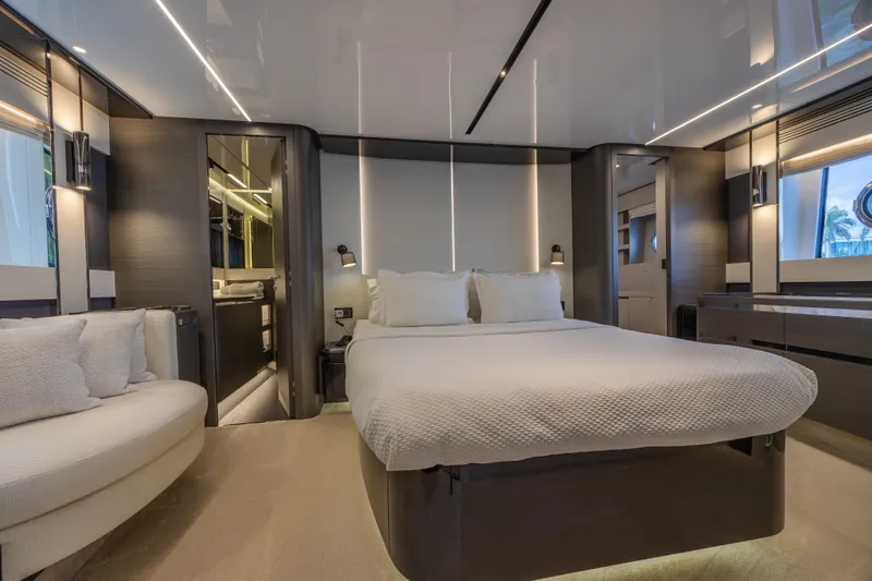 No Time To Die Yacht Photos Pics Luxurious bedroom interior of 2023 Azimut S8 yacht with modern design and elegant furnishings.
