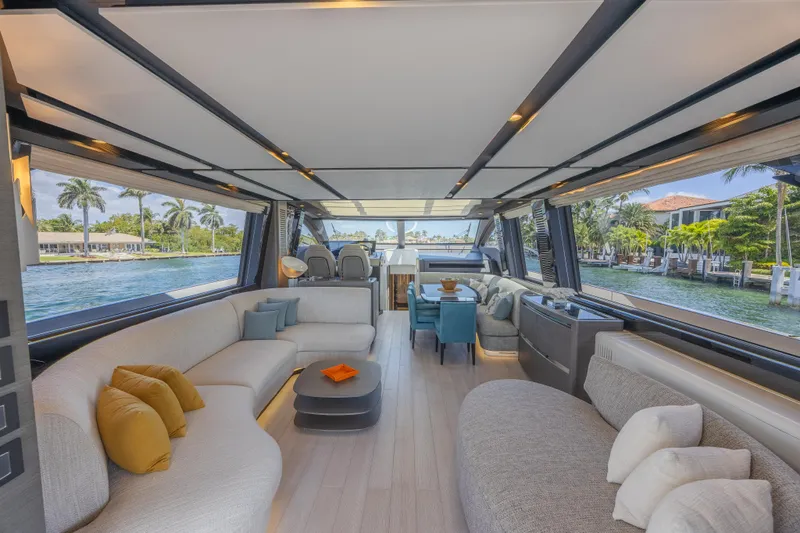 No Time To Die Yacht Photos Pics Luxurious interior of 2023 Azimut S8 yacht with elegant seating and scenic water views.