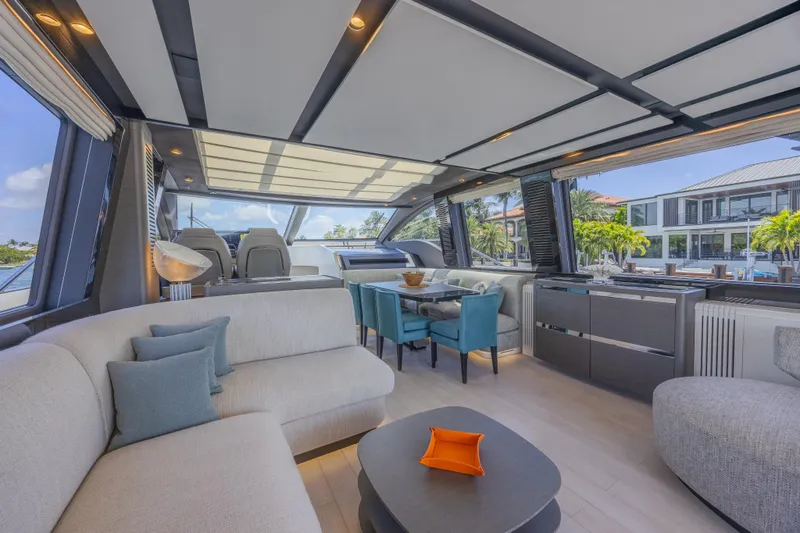 No Time To Die Yacht Photos Pics Luxurious interior of 2023 Azimut S8 yacht with modern furnishings and panoramic windows.