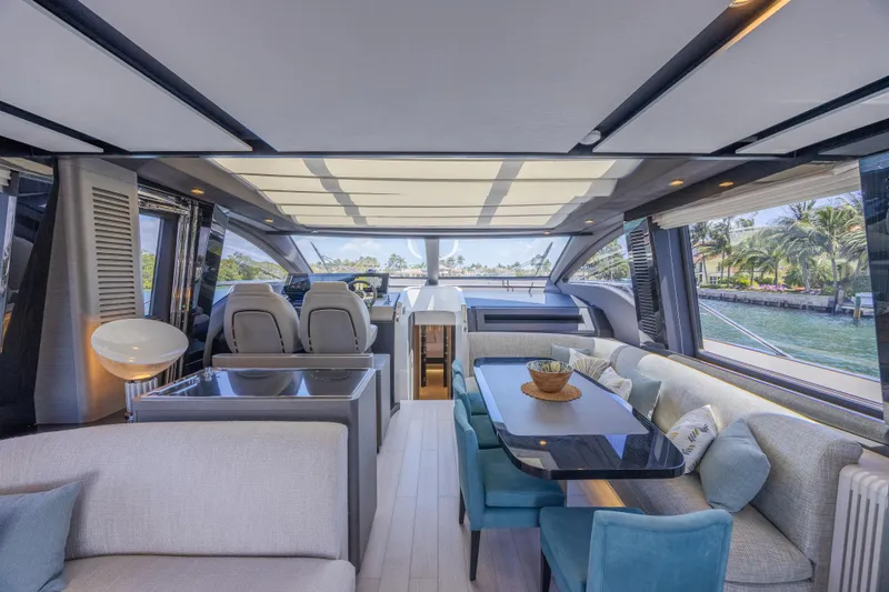 No Time To Die Yacht Photos Pics Luxurious interior of 2023 Azimut S8 yacht with modern seating and panoramic windows.