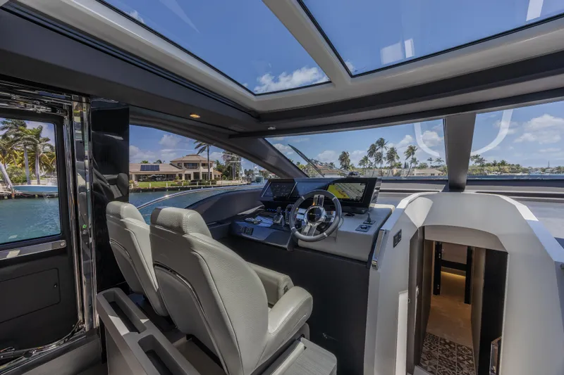 No Time To Die Yacht Photos Pics Interior of 2023 Azimut S8 yacht with modern helm and panoramic windows.