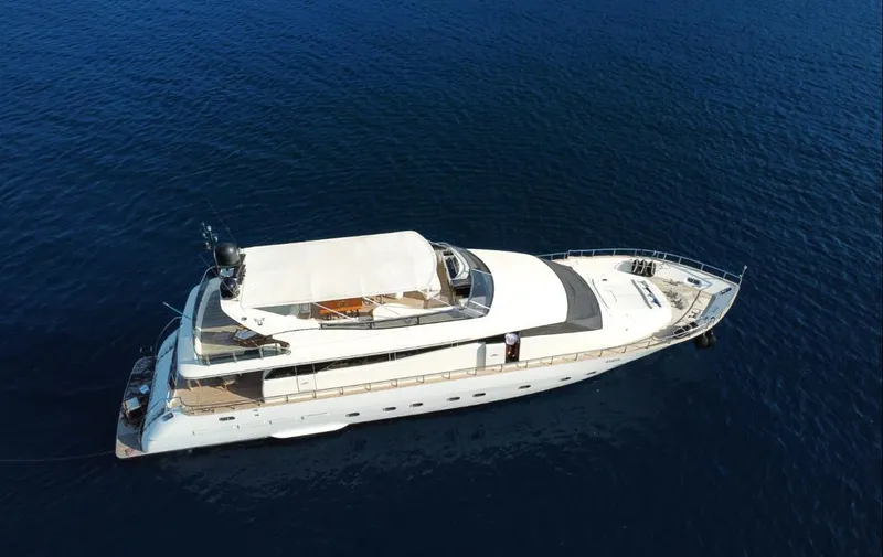  Yacht Photos Pics Luxury Leopard 26 Flybridge yacht from 2004 on calm blue sea.