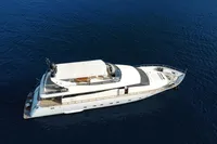 Luxury Leopard 26 Flybridge yacht from 2004 on calm blue sea.