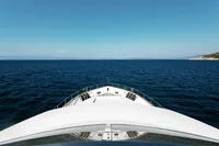 Leopard 26 Flybridge yacht cruising on open sea, 2004 model.