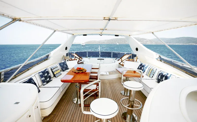  Yacht Photos Pics Luxurious 2004 Leopard 26 Flybridge yacht with elegant seating and ocean view.