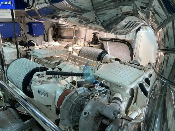  Yacht Photos Pics Engine room of a 2004 Leopard 26 Flybridge yacht, showcasing mechanical components.