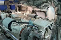 Engine room of a 2004 Leopard 26 Flybridge yacht, showcasing mechanical components.