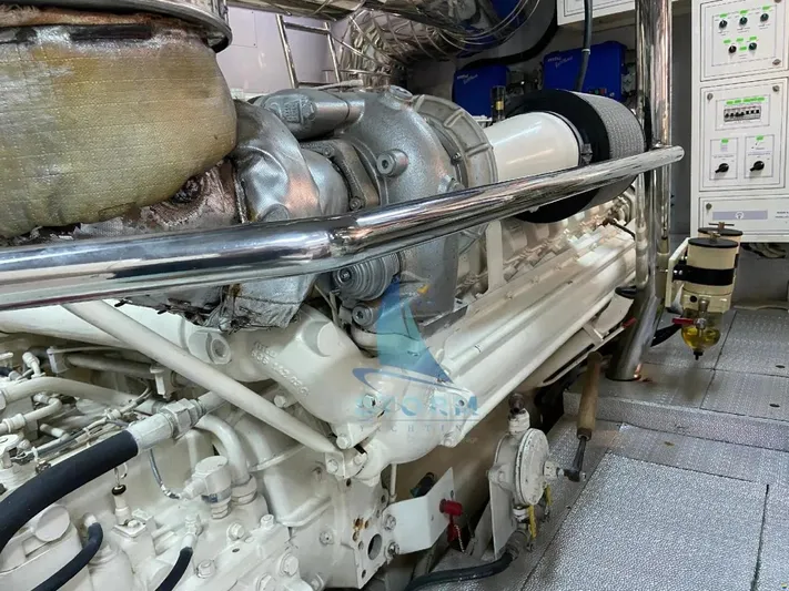  Yacht Photos Pics Engine room of 2004 Leopard 26 Flybridge yacht, showcasing machinery and control panels.