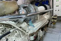 Engine room of 2004 Leopard 26 Flybridge yacht, showcasing machinery and control panels.