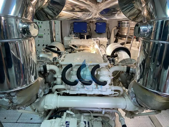  Yacht Photos Pics Engine room of a 2004 Leopard 26 Flybridge yacht, featuring polished metal components.