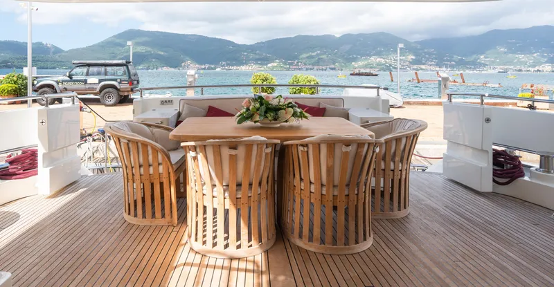 Jasmine Luna Yacht Photos Pics Luxurious 2007 Moonen JASMINE LUNA yacht deck with elegant dining area and scenic waterfront view.