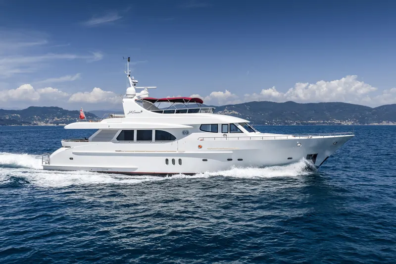 Jasmine Luna Yacht Photos Pics Luxury yacht Moonen JASMINE LUNA 2007 cruising on open sea with scenic mountain backdrop.