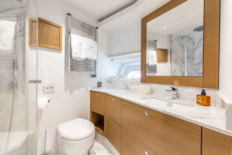 Jasmine Luna Yacht Photos Pics Luxurious bathroom on 2007 Moonen JASMINE LUNA yacht with modern fixtures and elegant wood accents.
