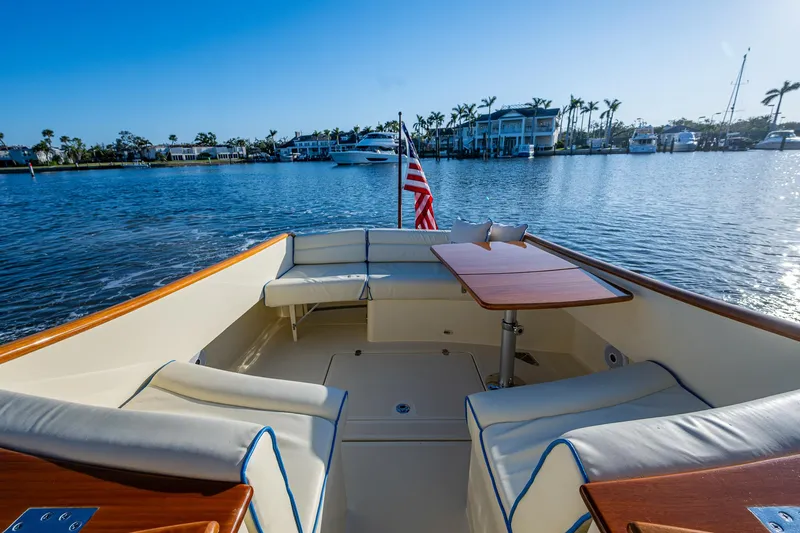 Niniane Yacht Photos Pics 2016 Hinckley Talaria 34 boat with elegant seating and table on calm water.