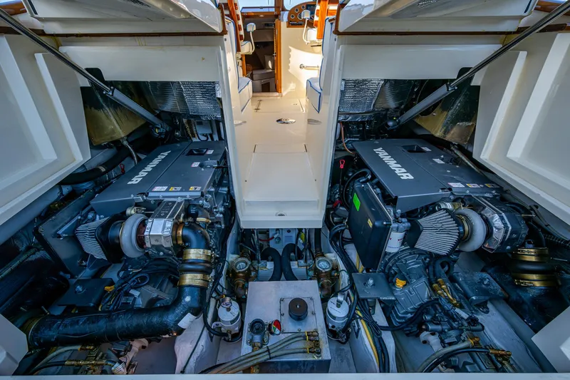 Niniane Yacht Photos Pics Engine room of a 2016 Hinckley Talaria 34, showcasing dual inboard engines.