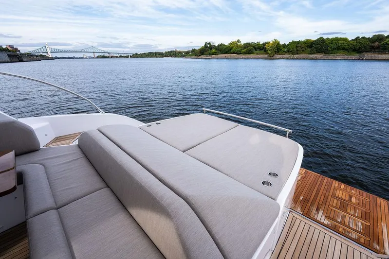  Yacht Photos Pics Azimut Atlantis 45 yacht deck overlooking serene water and distant bridge, 2025 model.