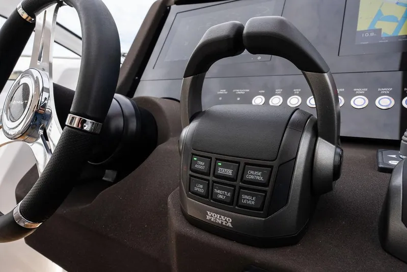  Yacht Photos Pics Control panel of 2025 Azimut Atlantis 45 yacht with steering wheel and navigation system.