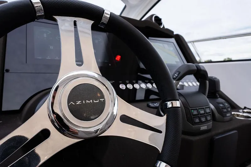  Yacht Photos Pics Steering wheel and dashboard of 2025 Azimut Atlantis 45 yacht.