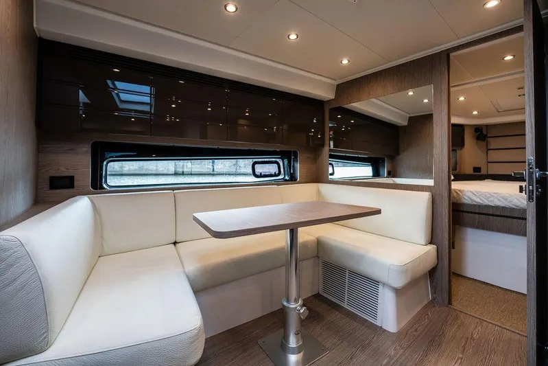  Yacht Photos Pics Luxurious interior of 2025 Azimut Atlantis 45 yacht with modern seating and dining area.