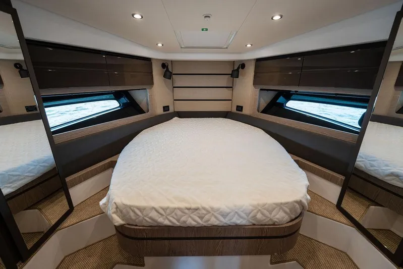  Yacht Photos Pics Luxurious bedroom interior of 2025 Azimut Atlantis 45 yacht with modern design.