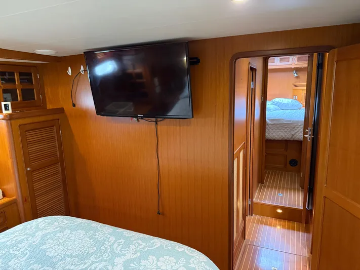 Marco Polo Yacht Photos Pics Interior of 2004 Selene Pilothouse yacht with wood paneling and mounted TV.