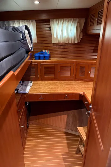 Marco Polo Yacht Photos Pics 2004 Selene Pilothouse interior with wooden cabinetry and desk area.