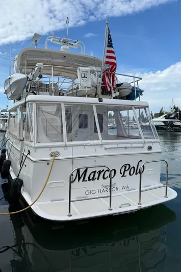 Marco Polo Yacht Photos Pics 2004 Selene Pilothouse yacht "Marco Polo" docked in Gig Harbor, WA, with American flag.