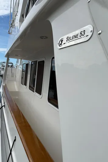 Marco Polo Yacht Photos Pics 2004 Selene Pilothouse yacht with sleek design and polished wood accents.