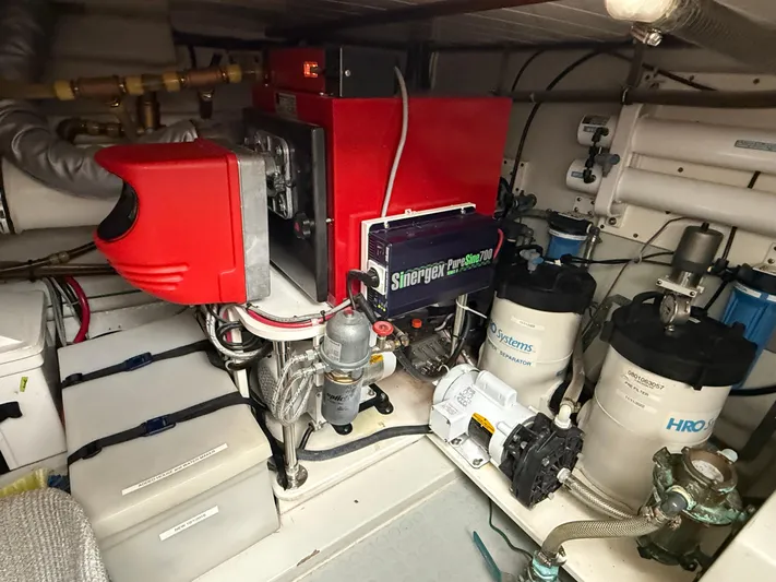 Marco Polo Yacht Photos Pics Engine room of a 2004 Selene Pilothouse yacht with various mechanical components.