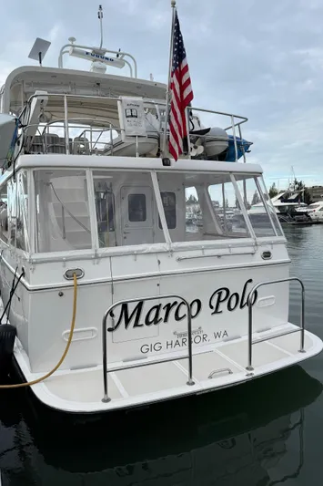 Marco Polo Yacht Photos Pics 2004 Selene Pilothouse yacht "Marco Polo" docked in Gig Harbor, WA, with American flag.