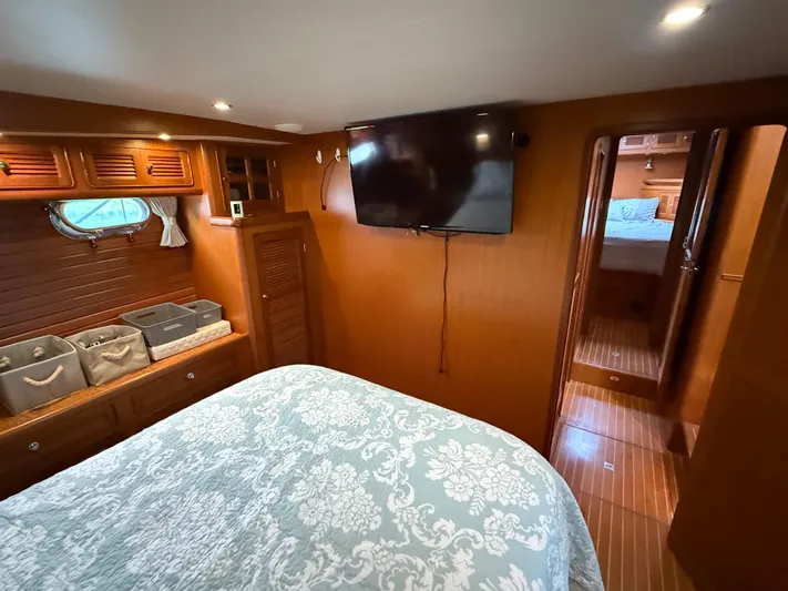 Marco Polo Yacht Photos Pics Luxurious 2004 Selene Pilothouse cabin interior with wood paneling and modern amenities.