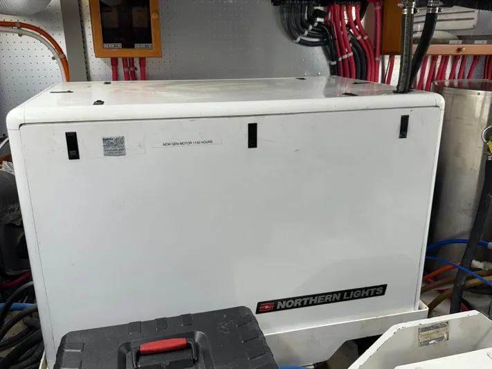 Marco Polo Yacht Photos Pics Northern Lights generator in 2004 Selene Pilothouse engine room, labeled 'New Gen Motor 1140 Hours'.