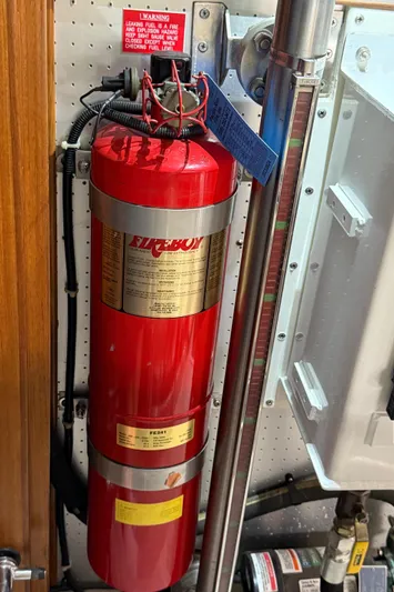 Marco Polo Yacht Photos Pics Fire extinguisher in 2004 Selene Pilothouse engine room, mounted on wall for safety.