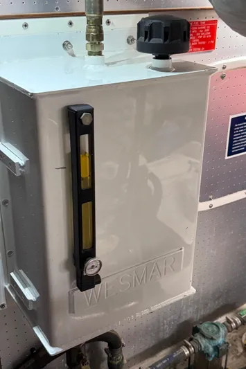 Marco Polo Yacht Photos Pics Engine room component on a 2004 Selene Pilothouse yacht, featuring a gauge and control knob.