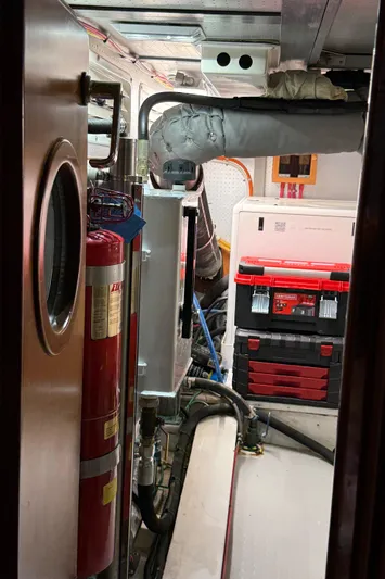Marco Polo Yacht Photos Pics Engine room of 2004 Selene Pilothouse with tools and fire extinguisher.