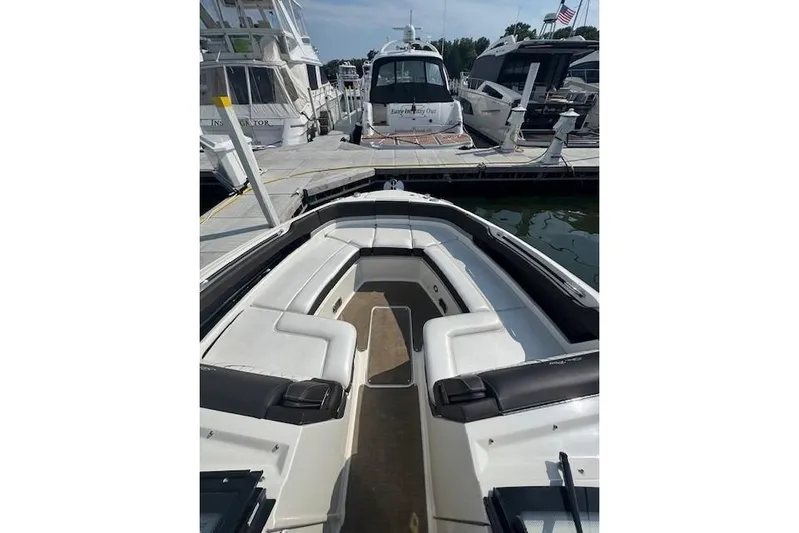  Yacht Photos Pics 2017 Sea Ray SLX 310 Outboard boat docked, featuring spacious seating and sleek design.