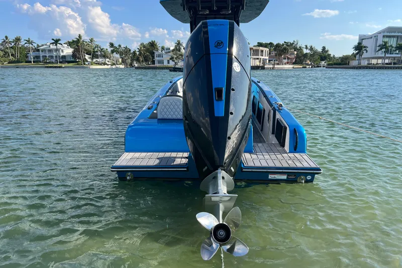  Yacht Photos Pics 2025 Concept 27' Open Deck boat on clear water, showcasing sleek design and powerful engine.