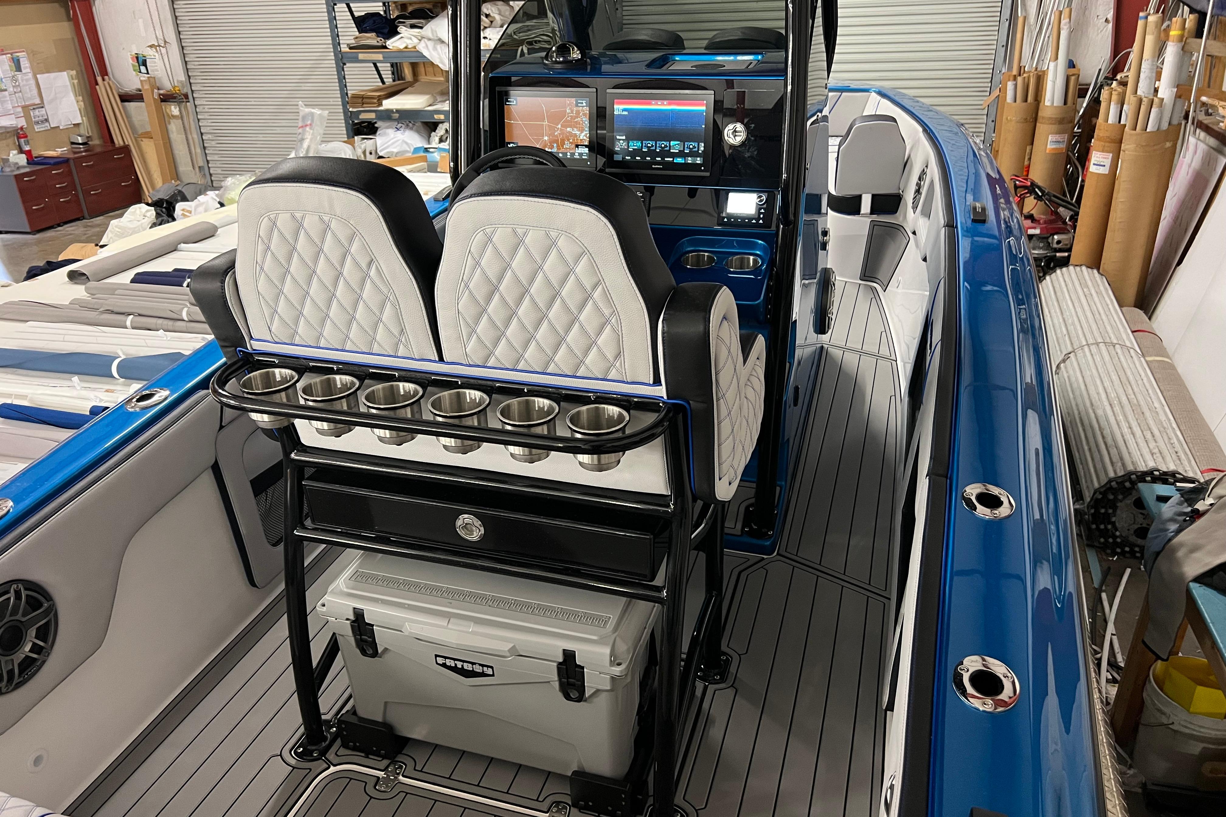 2025 Concept 27' Open Deck boat interior with modern seating and navigation system.