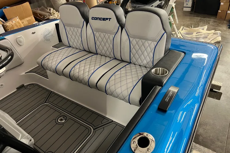  Yacht Photos Pics 2025 Concept 27' Open Deck boat interior with blue and white seating and cup holder.