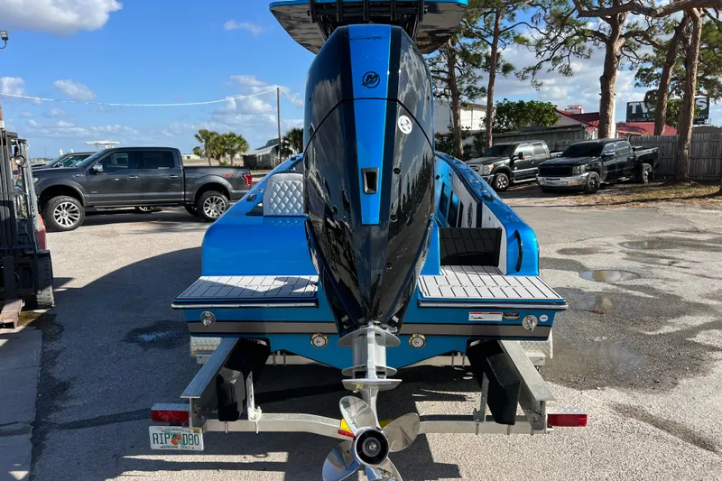  Yacht Photos Pics 2025 Concept 27' Open Deck boat with powerful outboard motor, parked on a trailer.